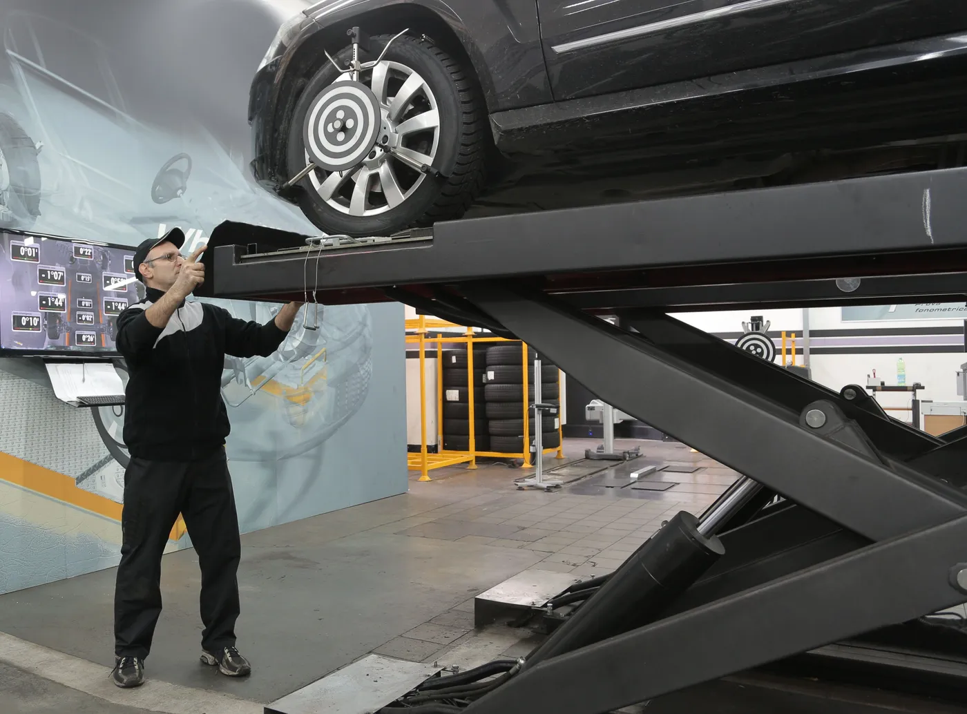 Car on a wheel alignment rig